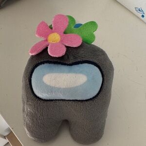 Gray Stuffed Animal with Pink Flower